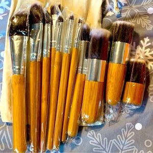 NWOT 11 Piece Bamboo Makeup Brushes In Cotton Blend Bag. Price $19